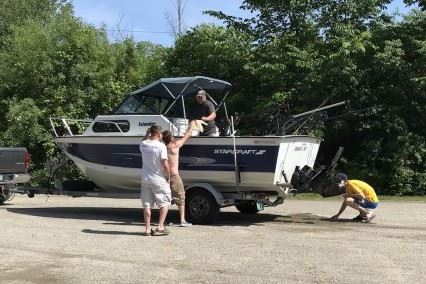 Lake St. Catherine Association Greeter inspecting a boat for aquatic invasive species.